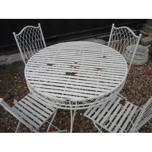 264 - Metal circular outdoor dining table with four chairs