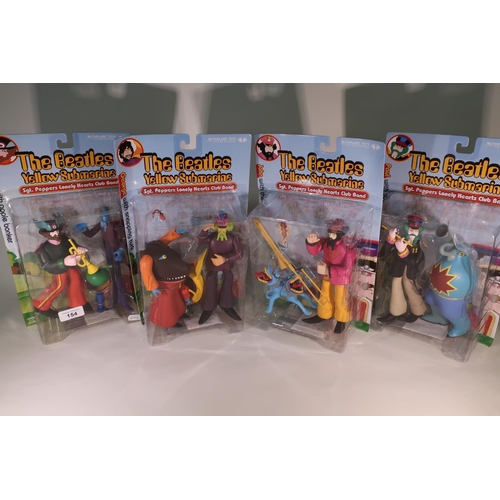 154 - Four McFarland Toys boxed and sealed The Beatles Yellow Submarine, Sergeant Pepper's Lonely Hearts C... 