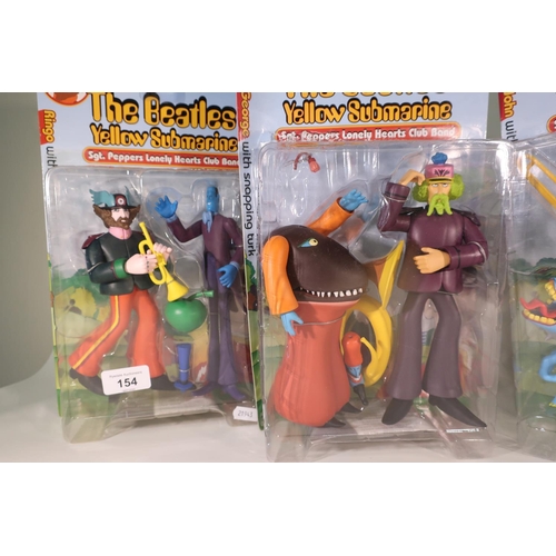 154 - Four McFarland Toys boxed and sealed The Beatles Yellow Submarine, Sergeant Pepper's Lonely Hearts C... 