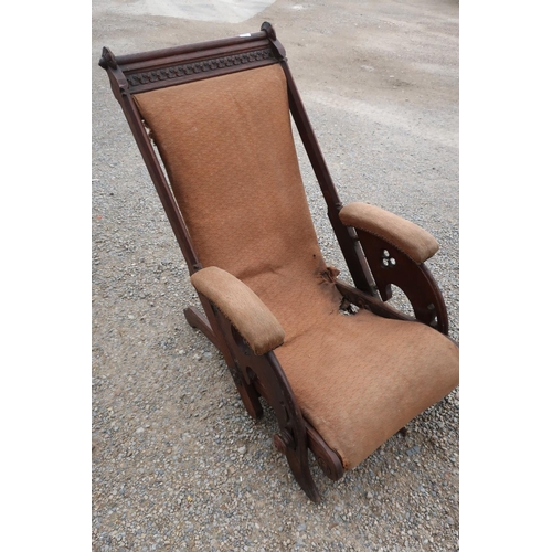 166 - Unusual late Victorian oak Gothic style reclining armchair with carved detail and upholstered seat a... 