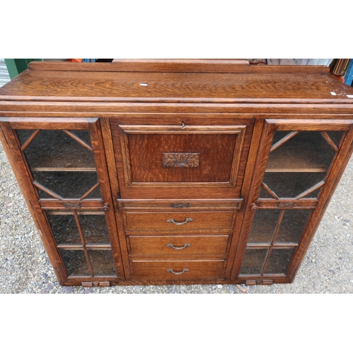 170 - 1930s oak combination secretaire cabinet with fall front above three drawers, flanked by two glazed ... 