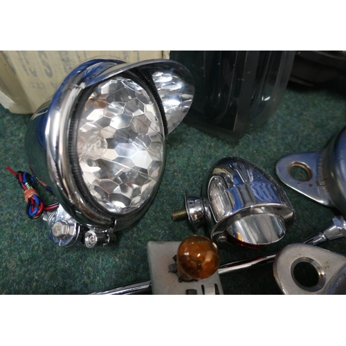 318 - Collection of various VW camper spares, including hub caps, head lamps, mirrors, covers, various par... 