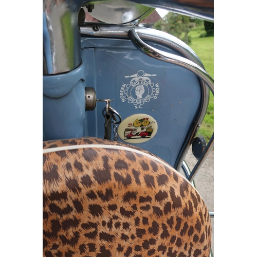 320 - 1959 Vespa 125CC scooter in blue and cream finish with leopard print seat and wheel cover, with vari... 