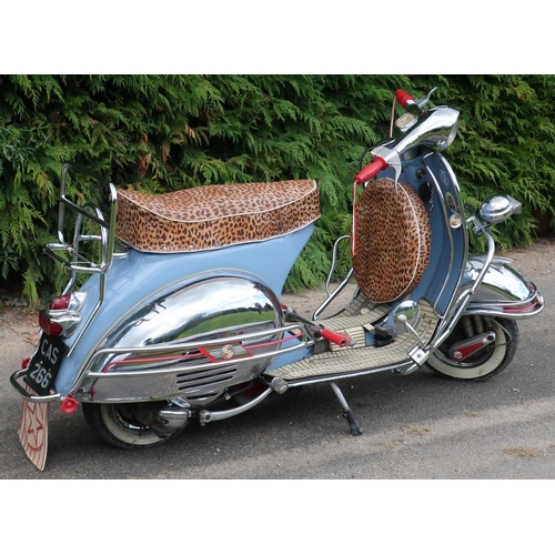 320 - 1959 Vespa 125CC scooter in blue and cream finish with leopard print seat and wheel cover, with vari... 