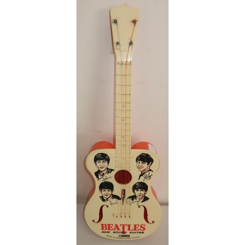 142b - Selco The Beatles New Sound toy guitar
