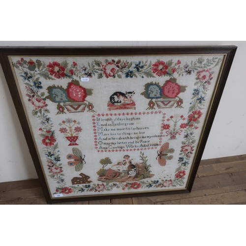 24 - Large framed and mounted wool-work sampler depicting various wildlife, floral patterns etc by Anne C... 