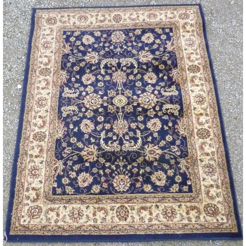70 - Heritage traditional pattern acrylic carpet blue and cream ground (160cm x 120cm)
