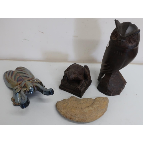 123 - Carved African hardwood figure of an owl, enameled boot pull, ammonite and a resin model of a frog