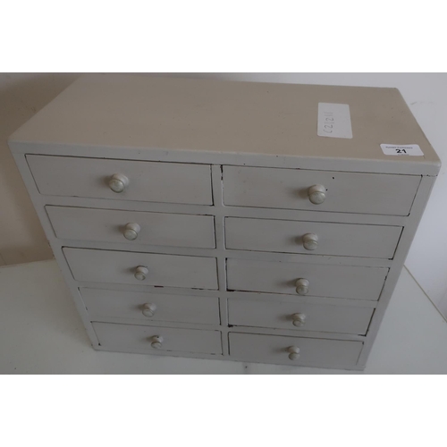 21 - Painted desk top multi-bank of ten short drawers (42.5cm x 19.5cm x 36cm)