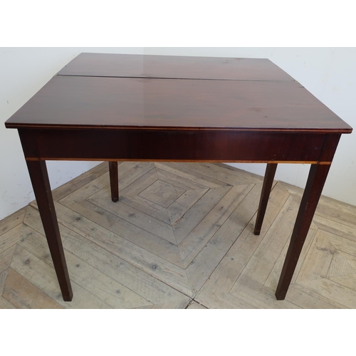 82 - 19th C mahogany rectangular fold over tea table with inlaid detail and square tapering supports (89c... 