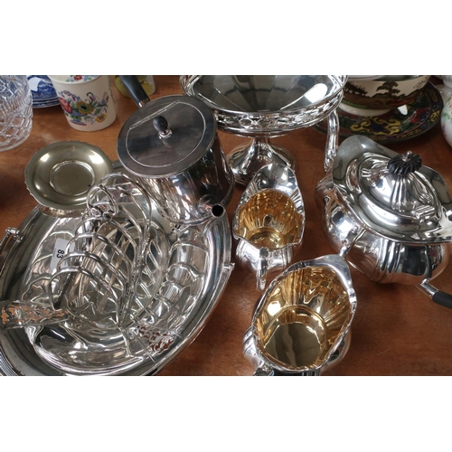 83 - Selection of various plated ware including three piece tea set, toast rack, comport etc