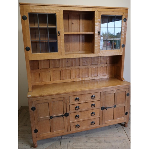137 - Yorkshire oak craftsman made Mouseman style dresser, the upper section with two tier open centre fla... 