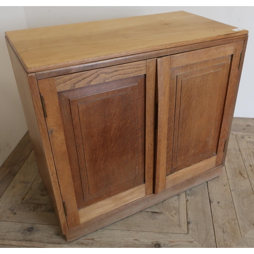 138 - Yorkshire oak craftsman made side cabinet enclosed by two panelled cupboard doors (75cm x 39cm x 68c... 