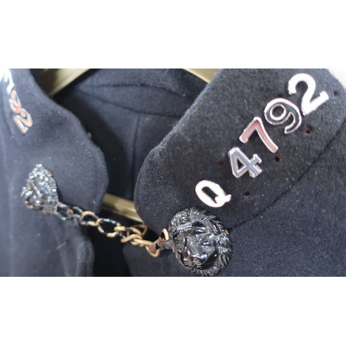 396 - 20th C police cape, blue woollen with chrome number Q4792 on collar, set of police handcuffs, and a ... 