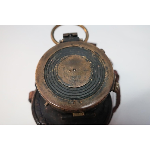 14 - Leather cased British WWI marching compass with traces of blackening, the reverse marked Pitkin with... 