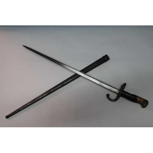 24 - French gras type bayonet with 20 1/2 inch blade, with broad backstrap marked 1878 with two piece woo... 