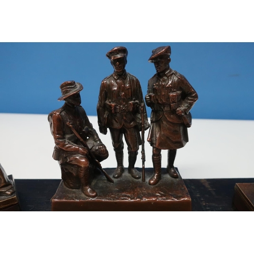 4 - Group of cast bronze British and Colonial c.WWI figures including central group of three flanked by ... 