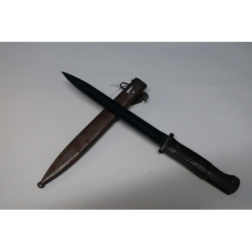 52 - German Mauser bayonet with 10 inch blackened blade stamped S/242G and 5911 with two piece wooden gri... 
