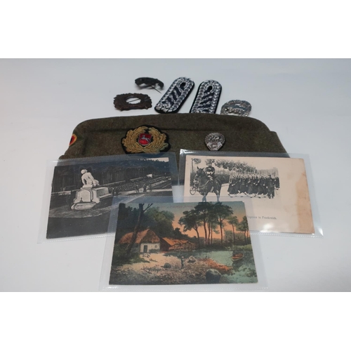 62 - German military side cap, three German postcards, various badges, shoulderboards, etc