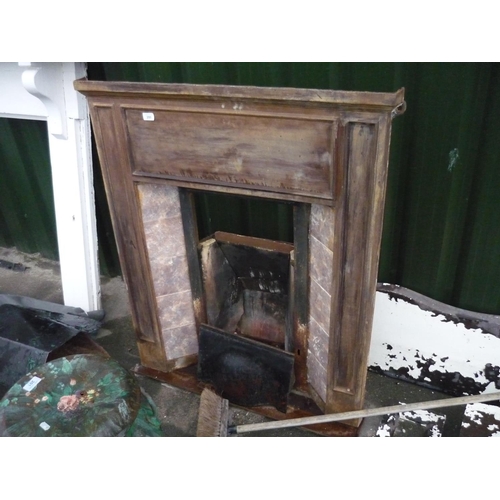 47 - Cast fire surround with tiles and fire back