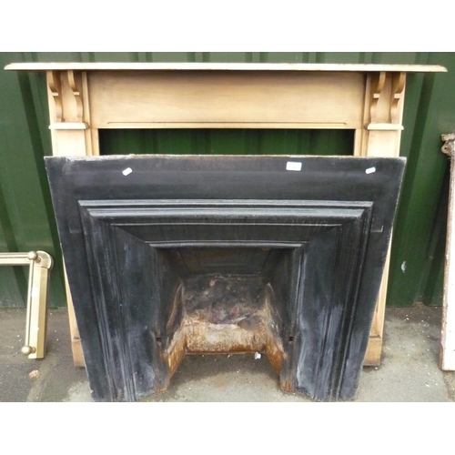 32 - Large cast fire place with wooden fire surround