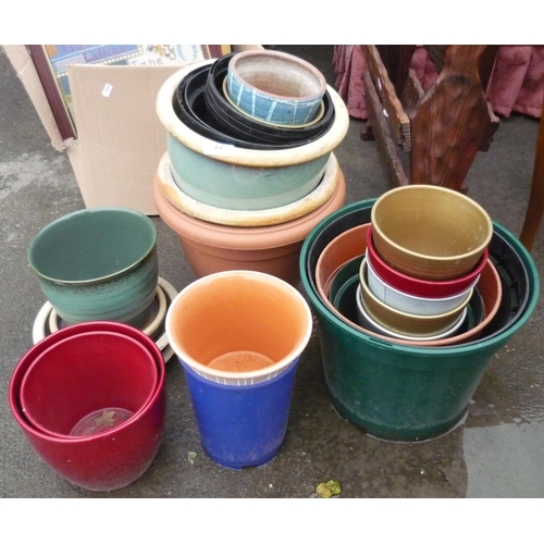 64 - Collection of plastic and stone planters