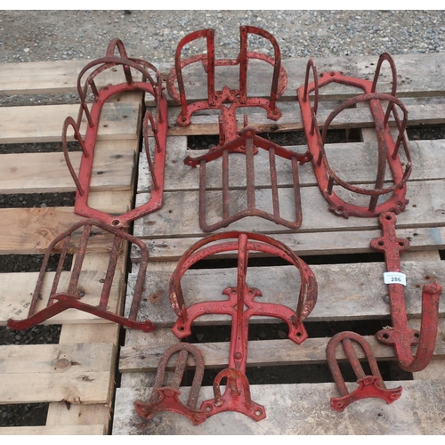 286 - Set of late 19th/early 20th C horse tack driving reins hangers and back saddles