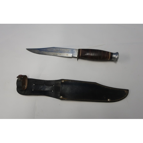 26 - Sheath knife with 5 inch blade engraved 