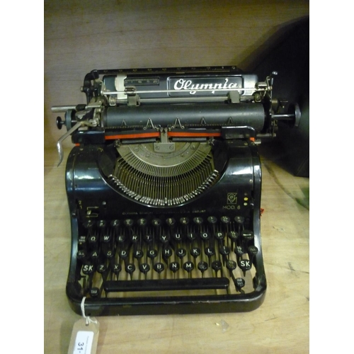 31 - Olympia MOD. 8 typewriter with Qwerty keyboard and cover