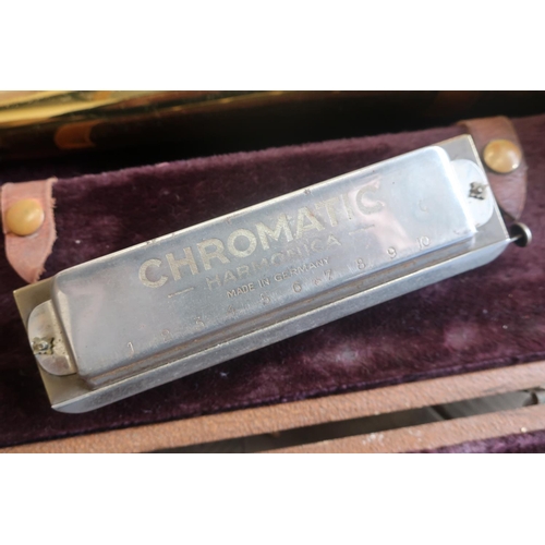 40 - Roth Reynolds Trombone No. 88537, in fitted case, and a Fischer Chromatic Harmonica