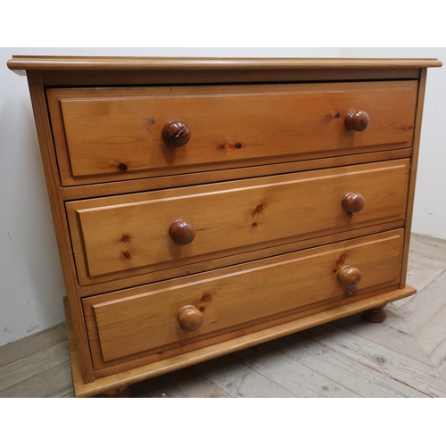 103 - The Cabinet Workshop Warwick, pine chest of three long drawers on bun feet (90cm x 72cm x 45cm)