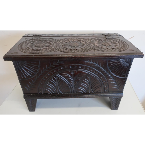 114 - Antique style fuel bin in the form of a carved oak planked coffer (52cm x 28cm x 34cm)