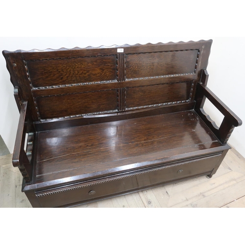 116 - Oak monks bench, with four paneled top above a single long drawer (130cm x 87cm x 50cm)