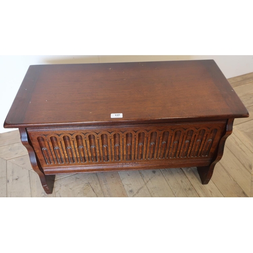 117 - Small reproduction oak blanket box, with hinged lid and fluted carved front (80cm x 36cm x 42cm)