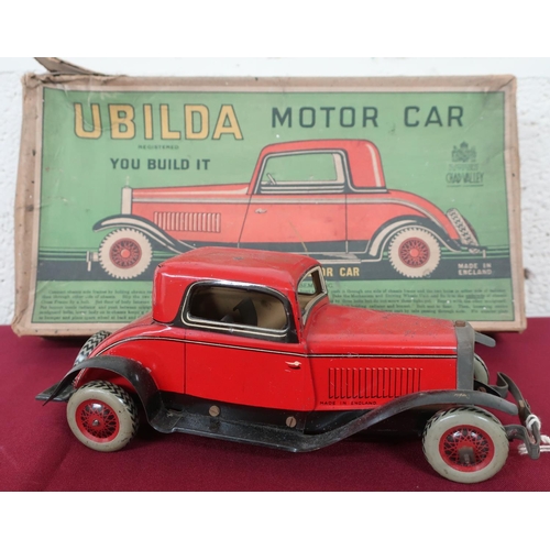 1 - A Ubilda tin plate clockwork motorcar by Chad Valley (25cm), with spanner and two spare nuts and bol... 