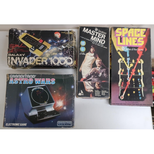 36 - Astro Wars console game, and a similar Galaxy Invader game, both boxed, Mastermind and Spaceline gam... 