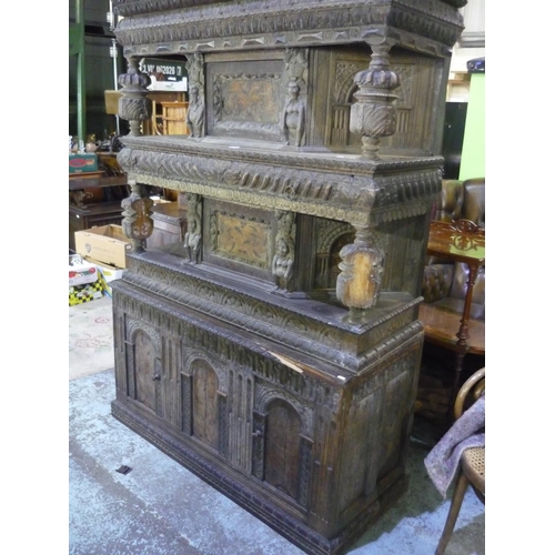 480 - Late 19th C 16th century style oak court cupboard, carved all over with arcades and mask heads, door... 