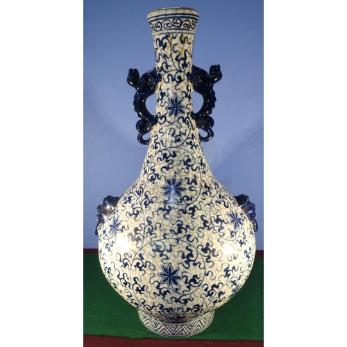 486 - Large Chinese blue and white crackle glaze bottle shaped vase, decorated with scrolling and leafage ... 