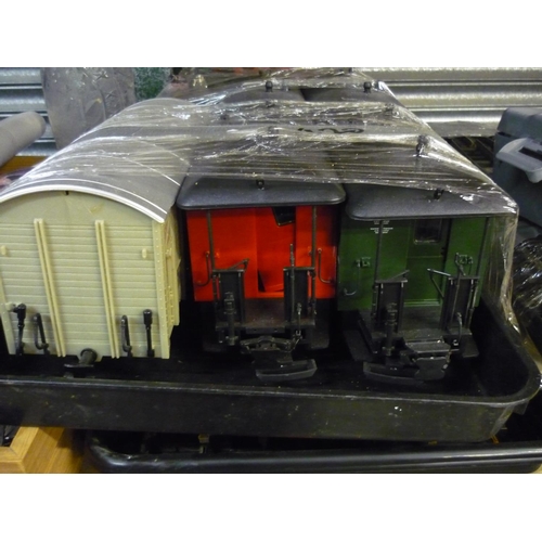 470 - Garden railway layout, comprising; Piko locomotive number 37105 high sided open wagon and guards van... 