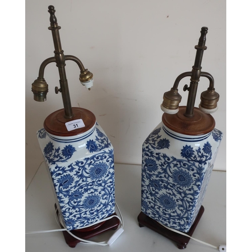 31 - Pair of blue & white Chinese table lamps, square tapering bodies on hard wood stands, with double ad... 