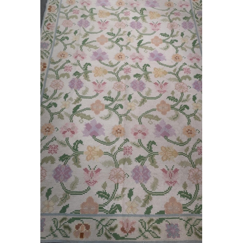 50 - Beige ground wool-work rug with floral pattern (178cm x 275cm)