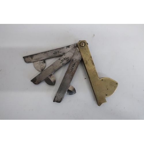 85 - Victorian brass fleam, the three steel blade stamped BAM Cast Steel (18cm long maximum)