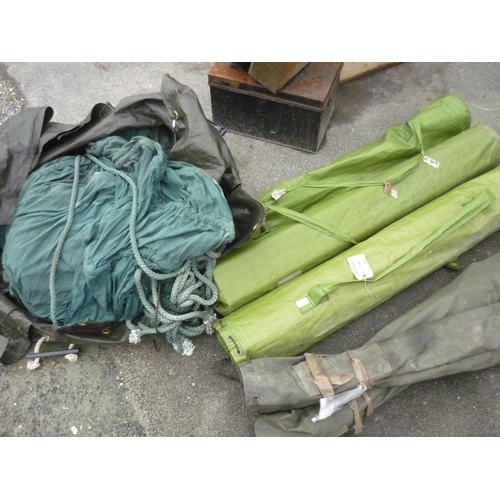 8 - Three bags containing minefield markers, two bags of tent poles, a large cargo net