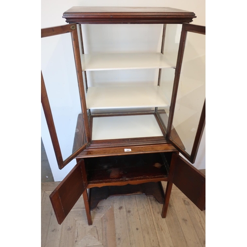 352 - Early 20th C mahogany display cabinet, glazed all round with two shelves, the base with two doors, o... 