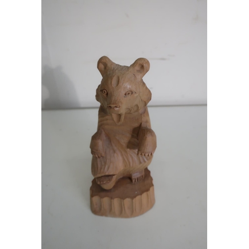 369 - Russian carved soft wood model of a bear, inscribed Moscow 1973 (18.5cm high)
