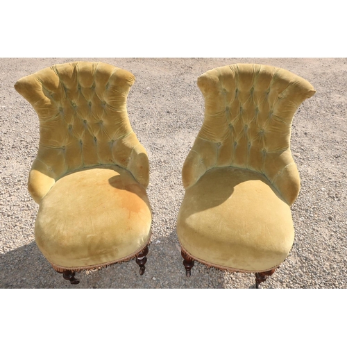 389 - Pair of Victorian nursing chairs, with deep buttoned upholstered shaped backs, bow front seats, on t... 