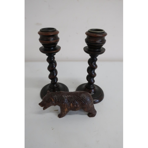 104 - Small carved Black Forest style bear (4cm high) and a pair of small turned wood barley twist candles... 