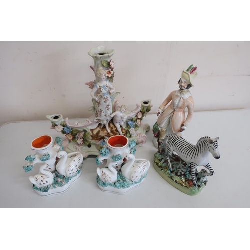 107 - Pair of Staffordshire style swan spill vases, similar zebra, a figure of a man with frock coat (A/F)... 