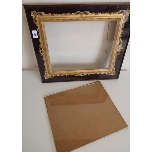 15 - 19th C gilt wood and gesso picture frame with pierced and scroll cresting, in velvet lined rosewood ... 