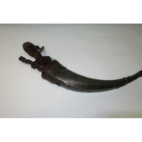 48 - Late 19th C carved Batak Sumatran  tribal horn flask, the horn with engraved detail with carved figu... 